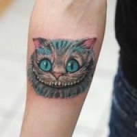 Значение и символизм татуировки чеширский кот
